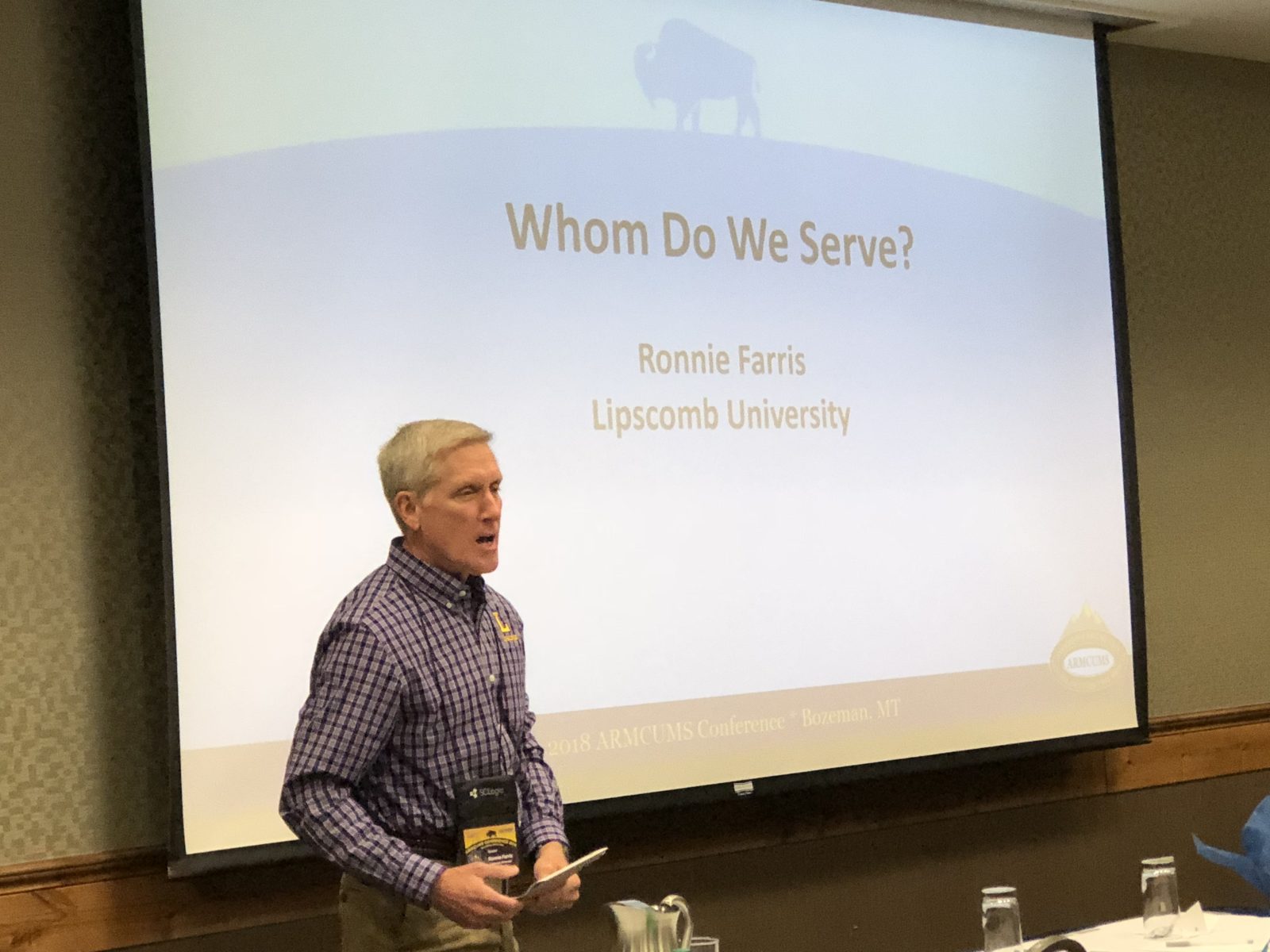 A man speaks in front of a presentation slide titled 'When Do We Say?'