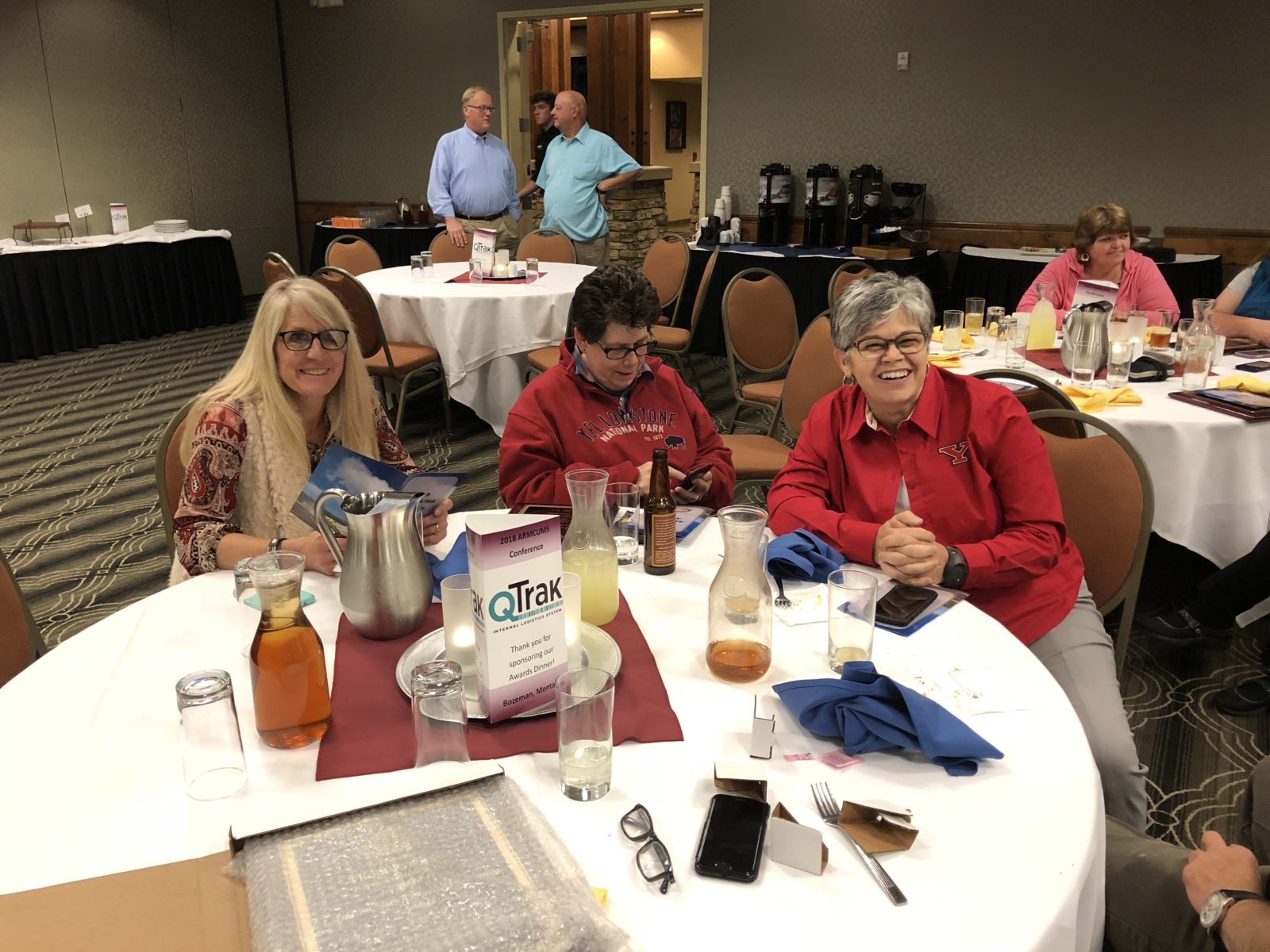 Group of people enjoying a meal together at a round table.