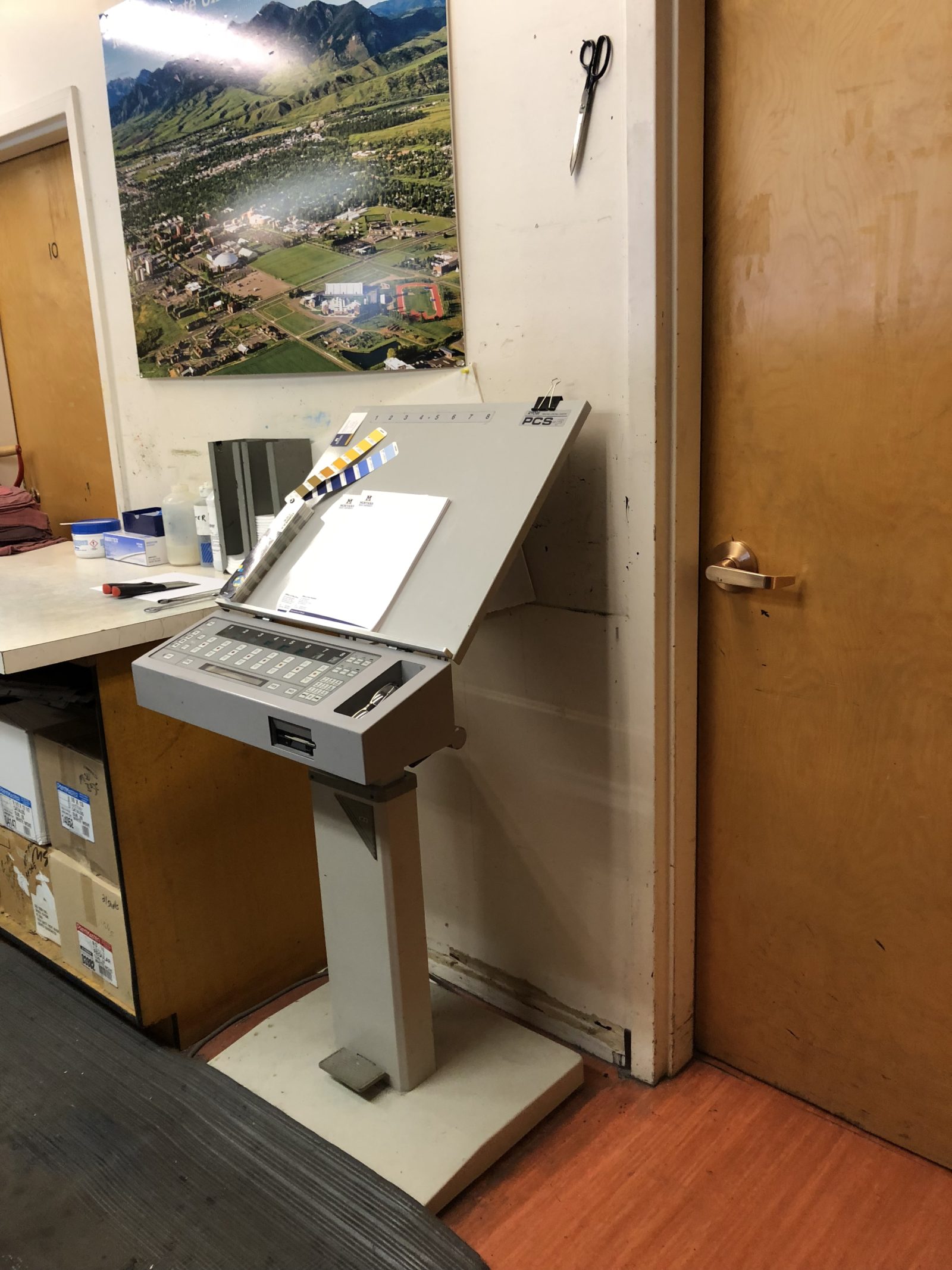 A medical or laboratory device on a stand in a clinical room.